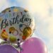 colorful birthday balloons representing a long distance parent celebrating their child's birthday from afar