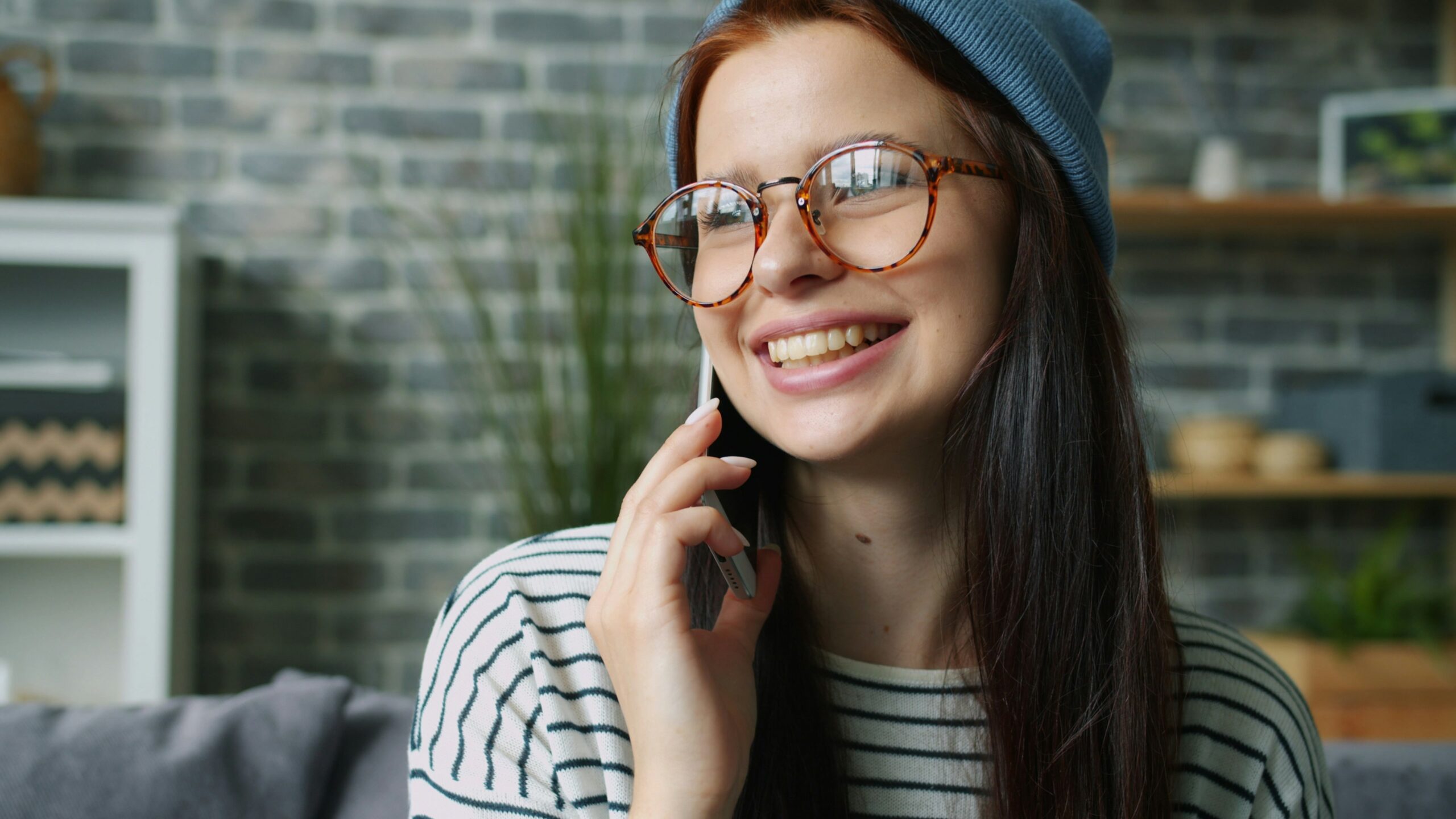 teenage girl on cell phone staying connected with long distance parent